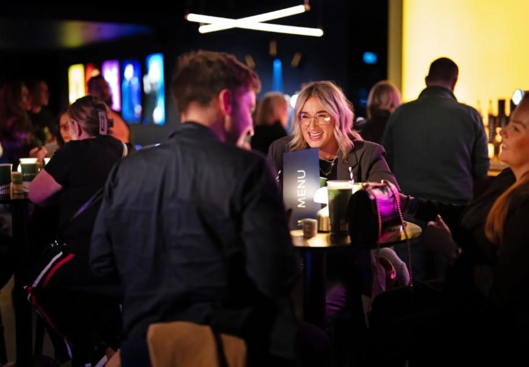 Customers laughing in the Sky Lounge at The SSE Arena Belfast