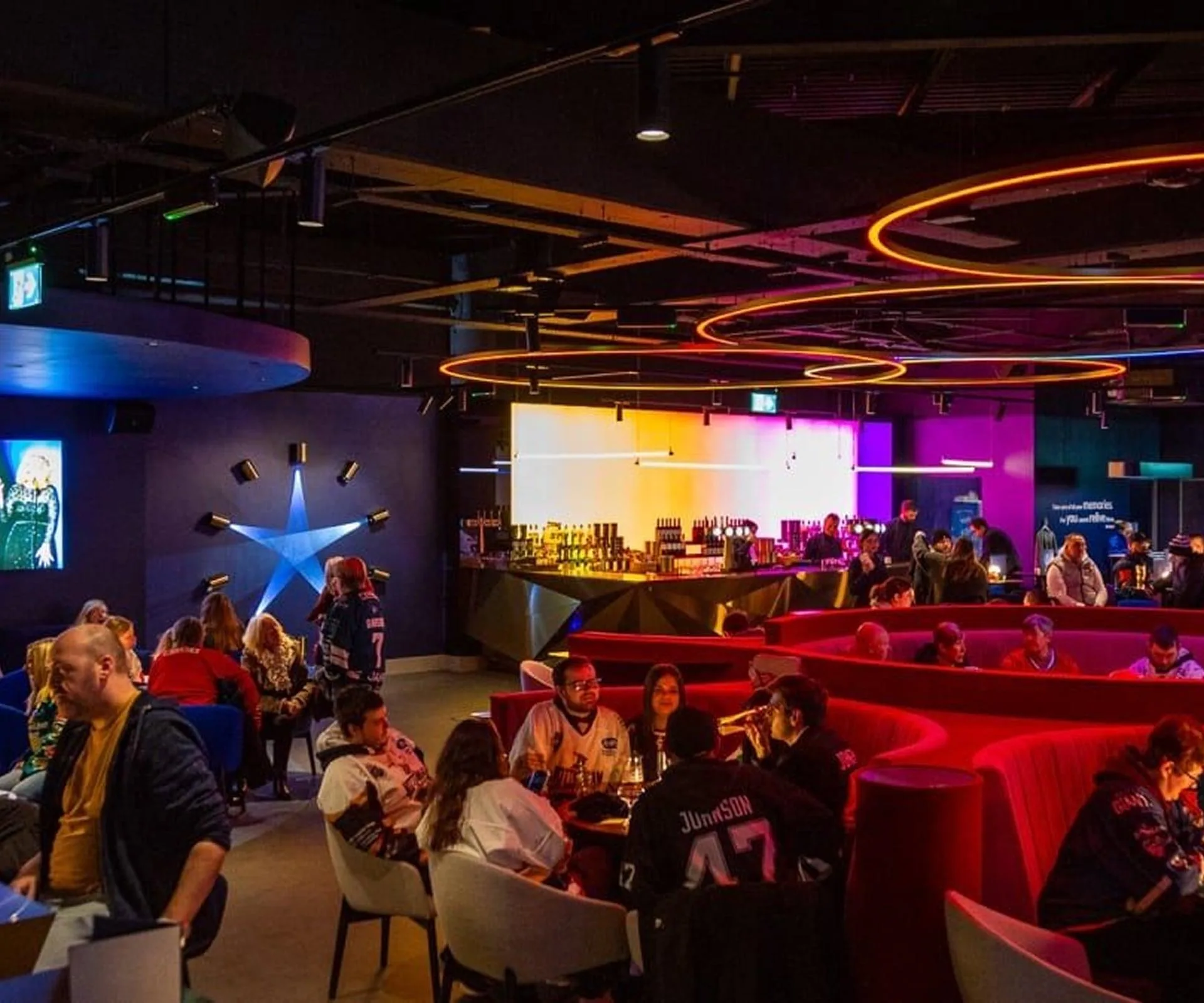 Sky vip lounge wide shot people enjoying